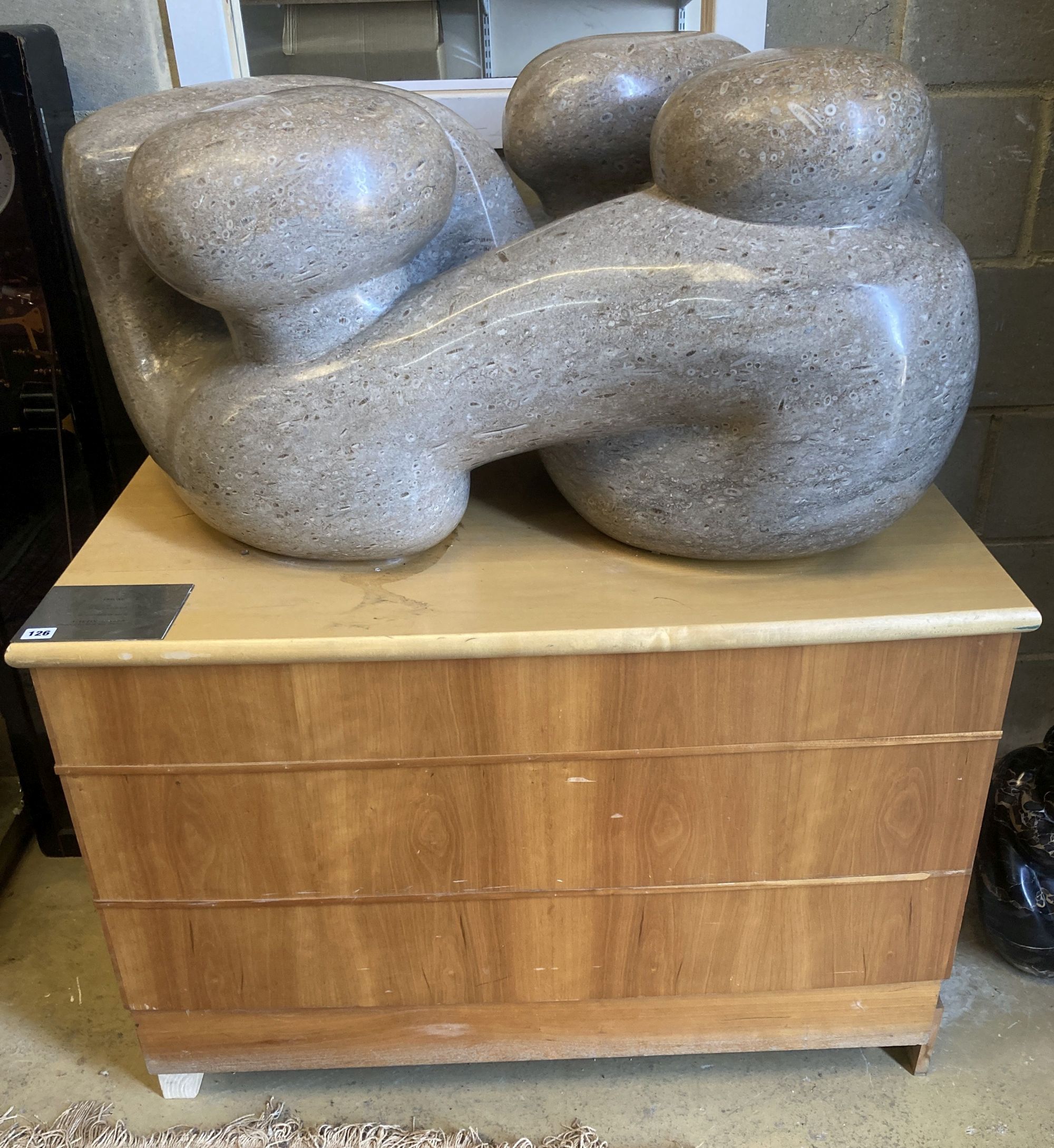 § Polly Ionides (born 1944) Triune, An abstract figural carved limestone group, width 106cm, depth 50cm, height 50cm